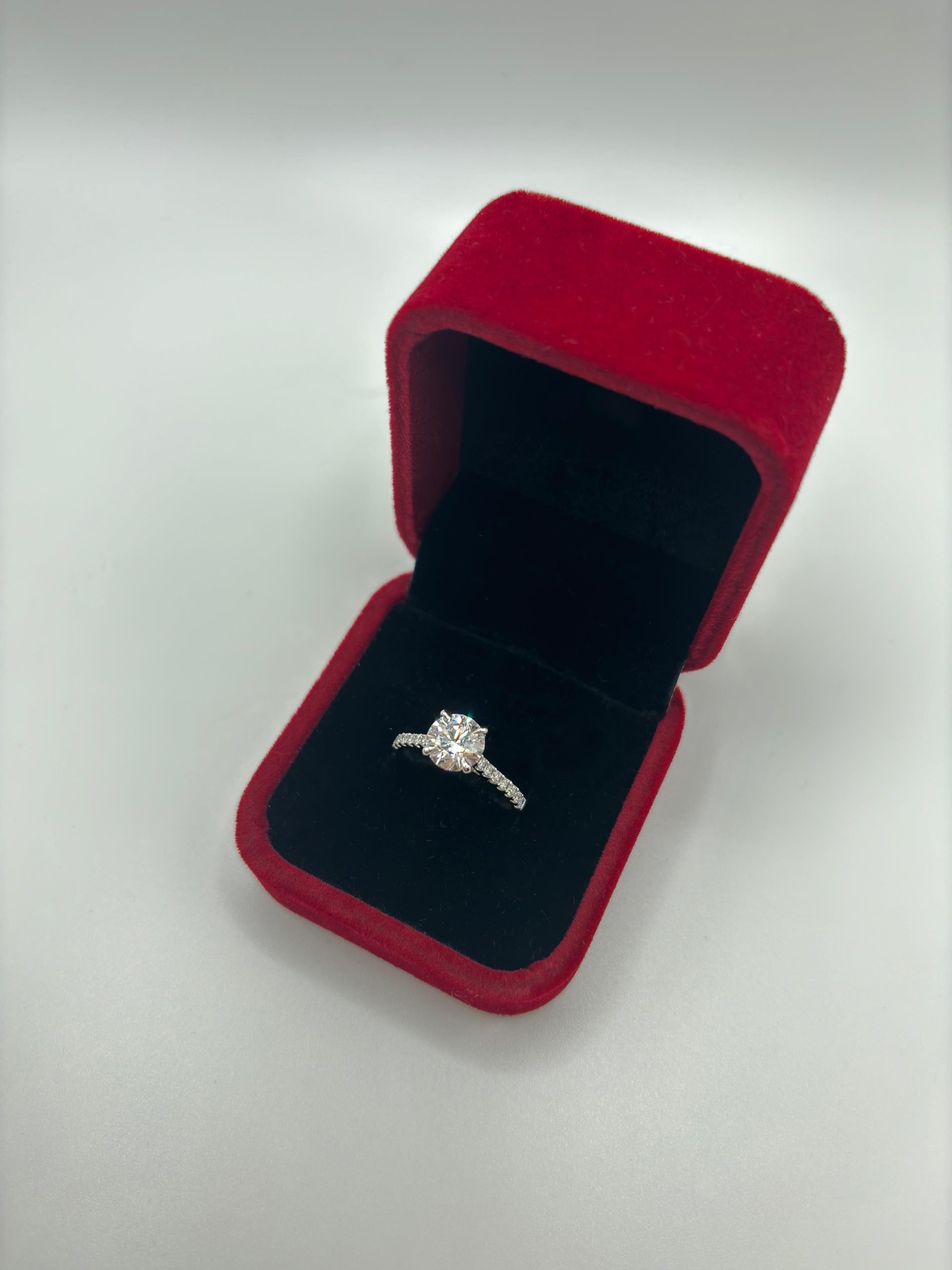 Photo of women's engagement ring made with white gold and set in diamonds